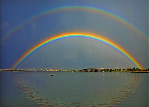 A rainbow, including a secondary rainbow